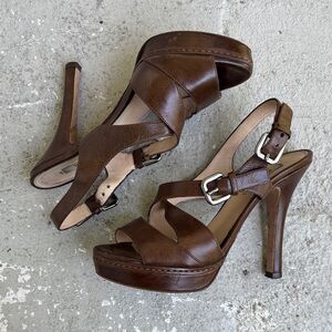 Prada crisscross open toe platforms